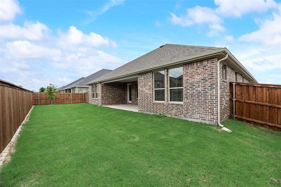 Front exterior of a new home in Sutton Fields, Celina, TX, highlighting curb appeal (Image 1).