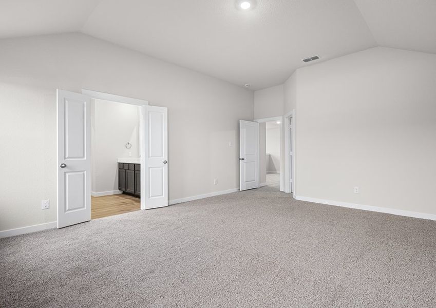 The master suite has a large bedroom, ensuite bathroom and a walk-in closet.