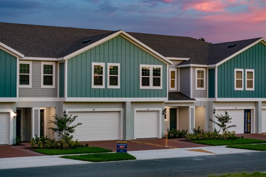 Front exterior of a new home in Blue Springs Reserve Townhomes, Groveland, FL, highlighting curb appeal (Image 12).