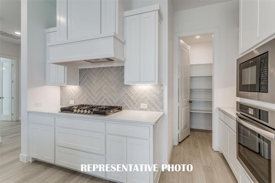 Beautiful finishes paired with a neutral color palette make this fantastic kitchen stand out from the crowd!  REPRESENTATIVE PHOTO