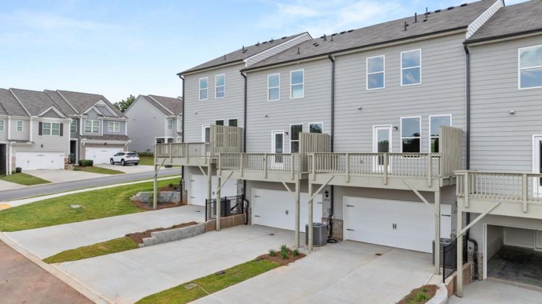 Exterior details and patio area of a home in Waypoint, Flowery Branch (Image 3).