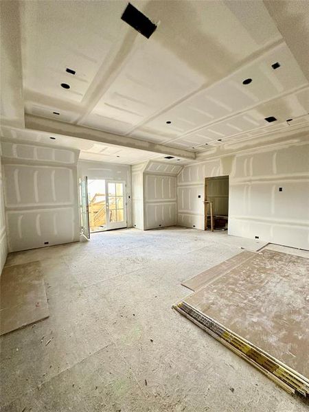 Another view of the gameroom with double doors leading to the balcony overlooking the front of the property. Current stage of construction 7/30/24.