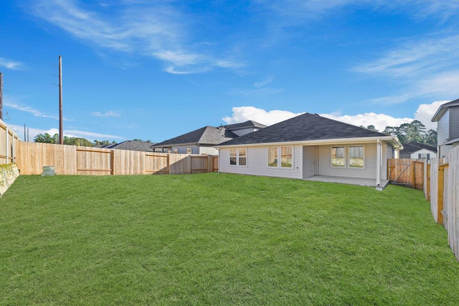 Exterior details and patio area of a home in Grand Pines, Magnolia (Image 12). Exterior details and patio area of a home in Grand Pines, Magnolia (Image 12).