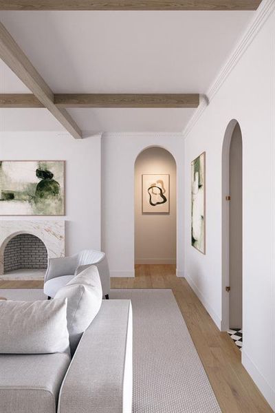 Living room featuring wood finished floors, arched walkways, beam ceiling, and a premium fireplace