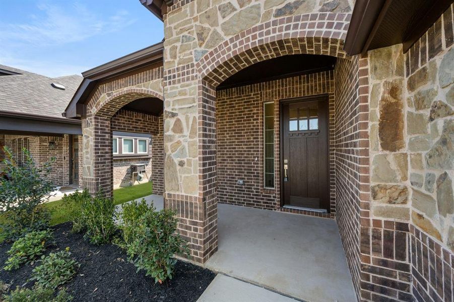 Exterior details and patio area of a home in Silo Mills - Select Series, Joshua (Image 3).