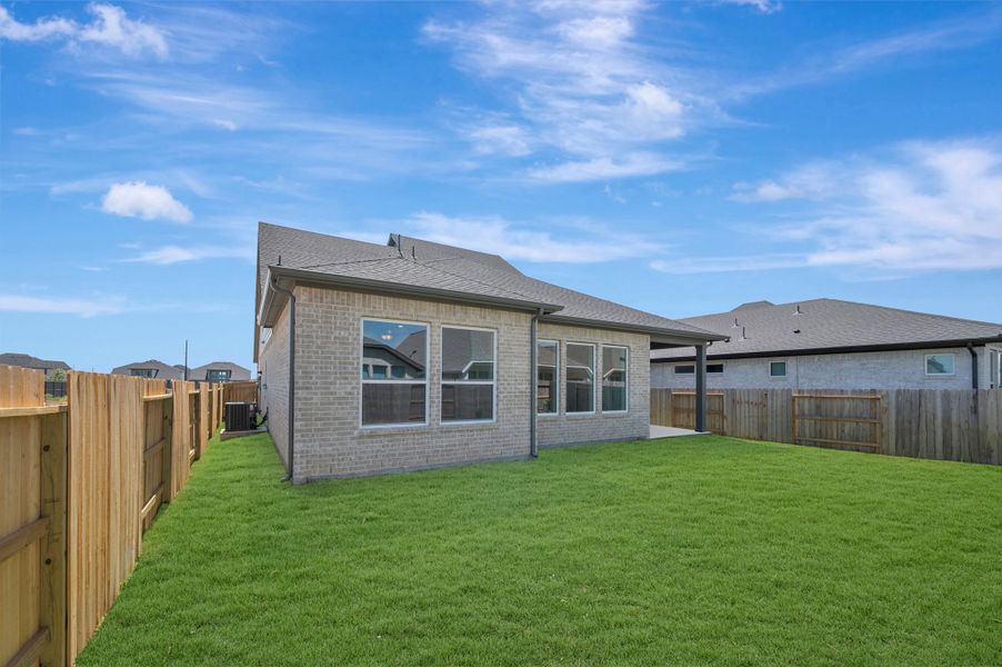 Exterior details and patio area of a home in The Grand Prairie - Retreat Collection, Hockley (Image 4).