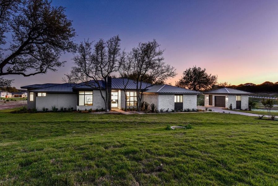 Front exterior of a new home in , Dripping Springs, TX, highlighting curb appeal (Image 18). Front exterior of a new home in , Dripping Springs, TX, highlighting curb appeal (Image 18).