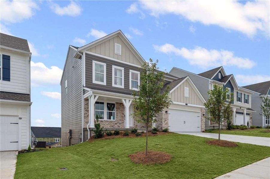 Front exterior of a new home in Twin Lakes, Braselton, GA, highlighting curb appeal (Image 16).