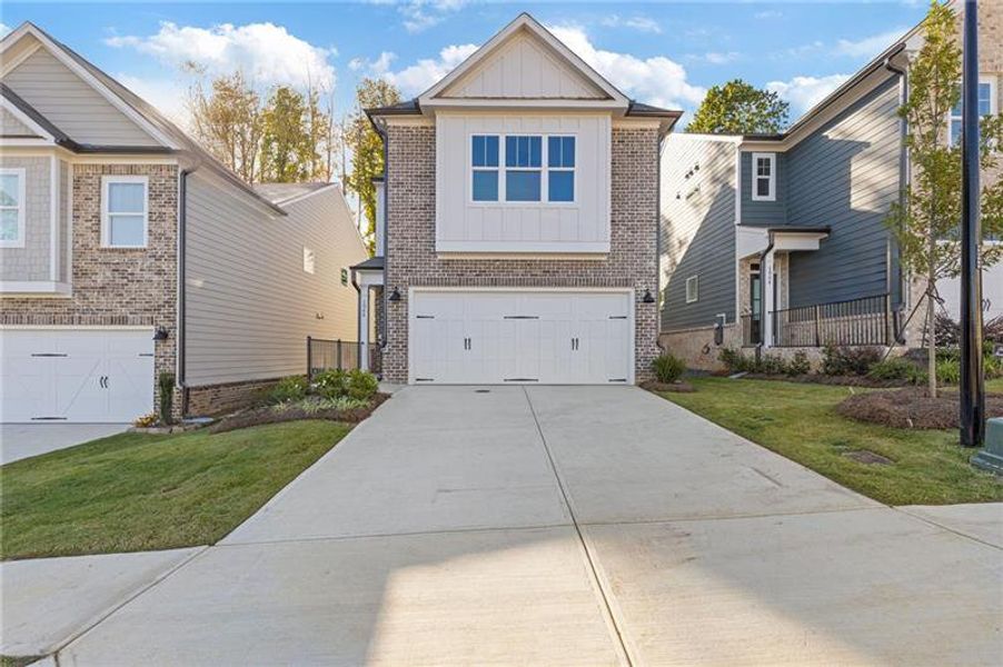 Front exterior of a new home in , Dacula, GA, highlighting curb appeal (Image 16).