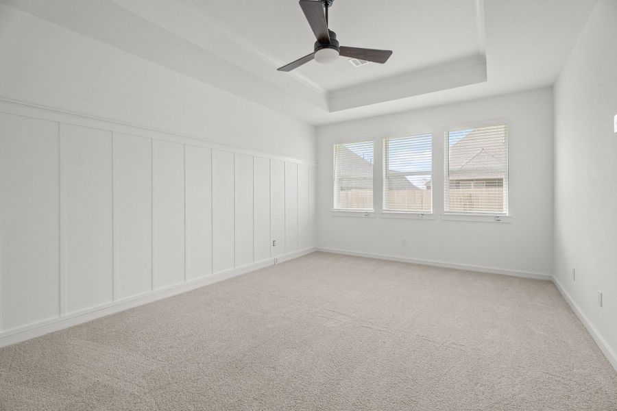 Spacious primary suite with feature wall Spacious primary suite with feature wall