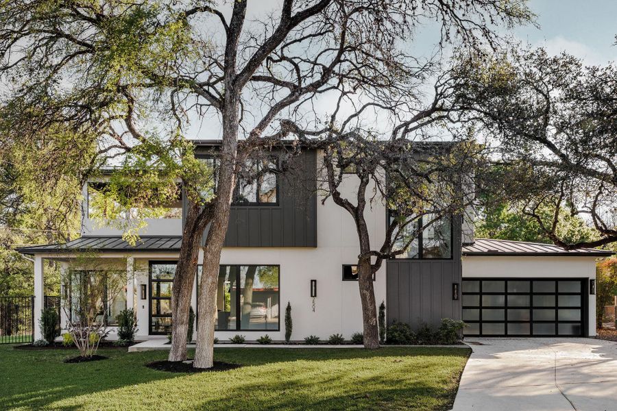 Welcome to Bluffview. The front presents a refined blend of materials, creating a striking modern architectural statement in a private cul-de-sac along the greenbelt. Welcome to Bluffview. The front presents a refined blend of materials, creating a striking modern architectural statement in a private cul-de-sac along the greenbelt.