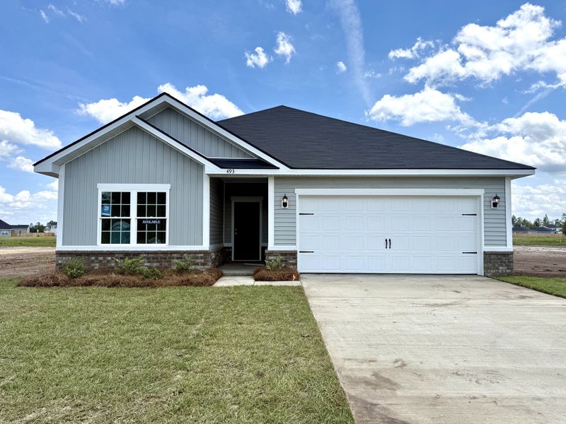 Front exterior of a new home in The Village at Sassafras, Allenhurst, GA, highlighting curb appeal (Image 1). Front exterior of a new home in The Village at Sassafras, Allenhurst, GA, highlighting curb appeal (Image 1).
