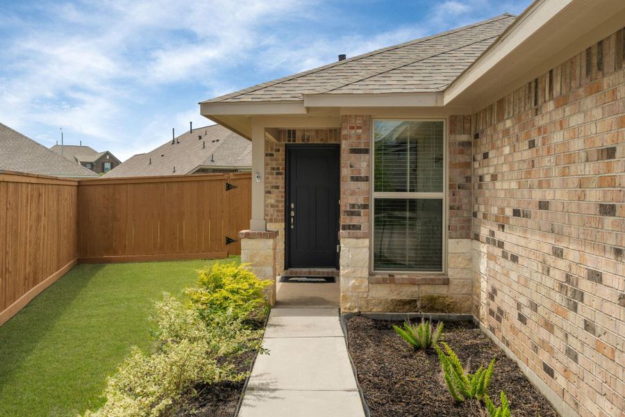 Exterior details and patio area of a home in Sunterra, Katy (Image 3).