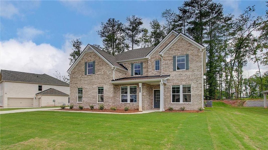 Front exterior of a new home in Trinity Park, McDonough, GA, highlighting curb appeal (Image 18).