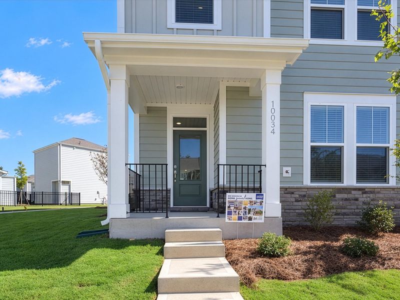 Exterior details and patio area of a home in North Creek Village - Townhomes, Huntersville (Image 19).