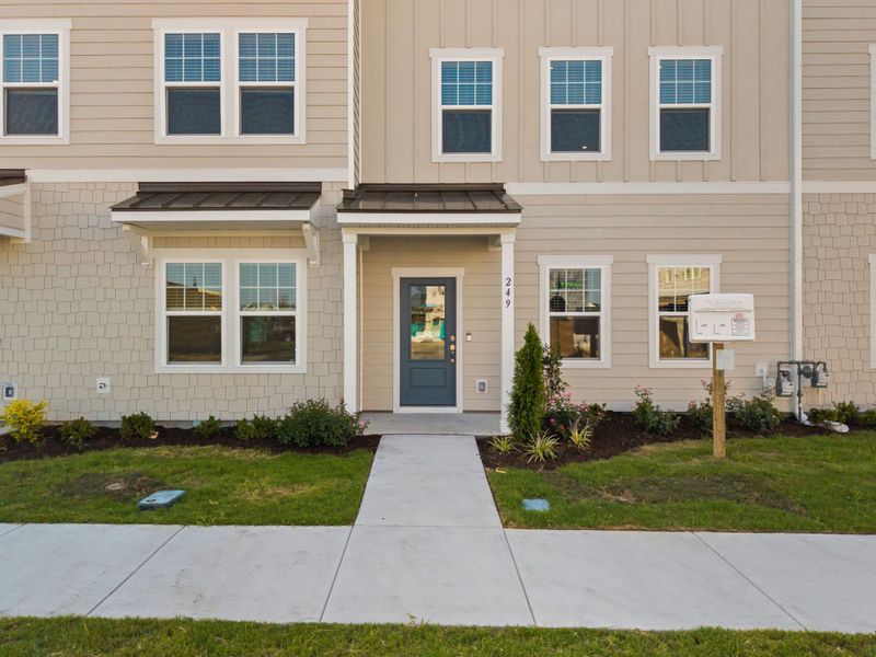 Exterior details and patio area of a home in Lakeside Townes at Riverlights, Wilmington (Image 3). Exterior details and patio area of a home in Lakeside Townes at Riverlights, Wilmington (Image 3).