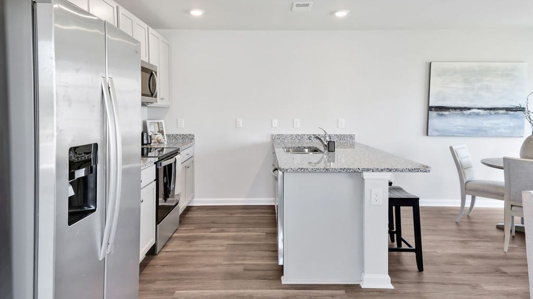 Representative furnished interior of a home built from the MITCHELL TOWNHOME by D.R. Horton in Grayson Park Townhomes, Leland (Image 10). Representative furnished interior of a home built from the MITCHELL TOWNHOME by D.R. Horton in Grayson Park Townhomes, Leland (Image 10).