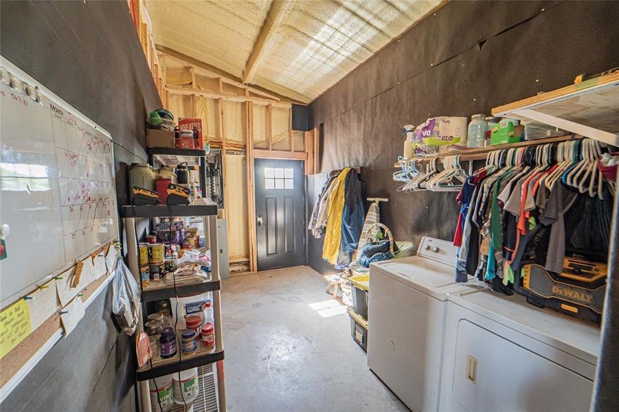 Laundry area featuring washing machine and clothes dryer