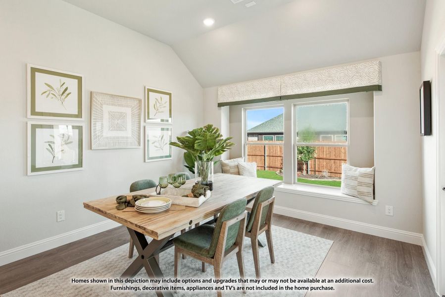 Dining room with wood table, green chairs, vaulted ceiling, window seat, and backyard view Dining room with wood table, green chairs, vaulted ceiling, window seat, and backyard view