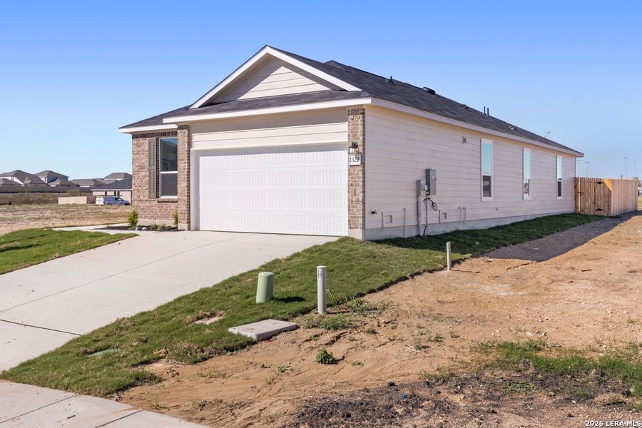 Front exterior of a new home in Legend Heights, New Braunfels, TX, highlighting curb appeal (Image 2). Front exterior of a new home in Legend Heights, New Braunfels, TX, highlighting curb appeal (Image 2).