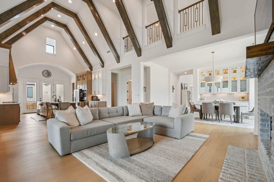 The property features an open living area with vaulted ceilings, exposed wooden beams, and light wood flooring The property features an open living area with vaulted ceilings, exposed wooden beams, and light wood flooring