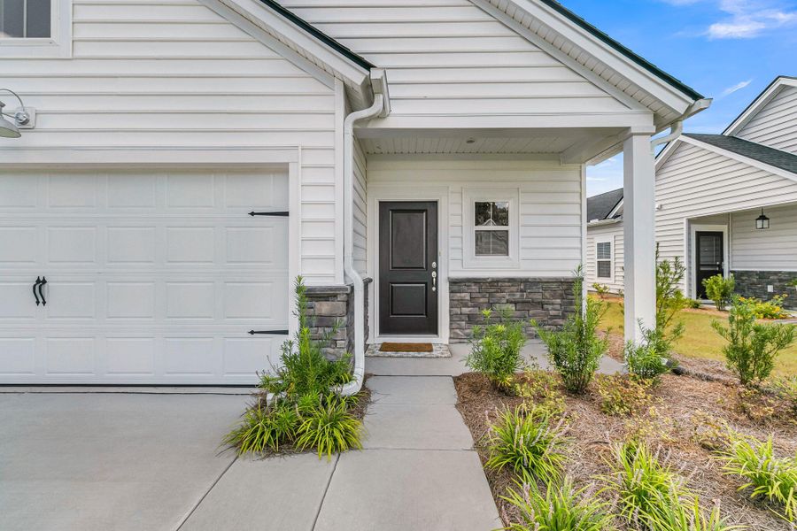 Exterior details and patio area of a home in Horizons at Summers Corner | 55+, Summerville (Image 31).