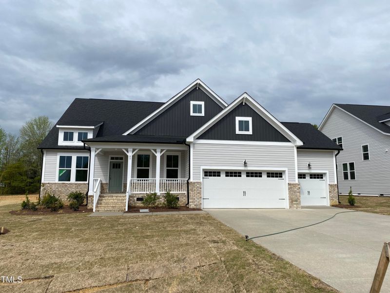 Front exterior of a new home in Tobacco Road, Angier, NC, highlighting curb appeal (Image 55).