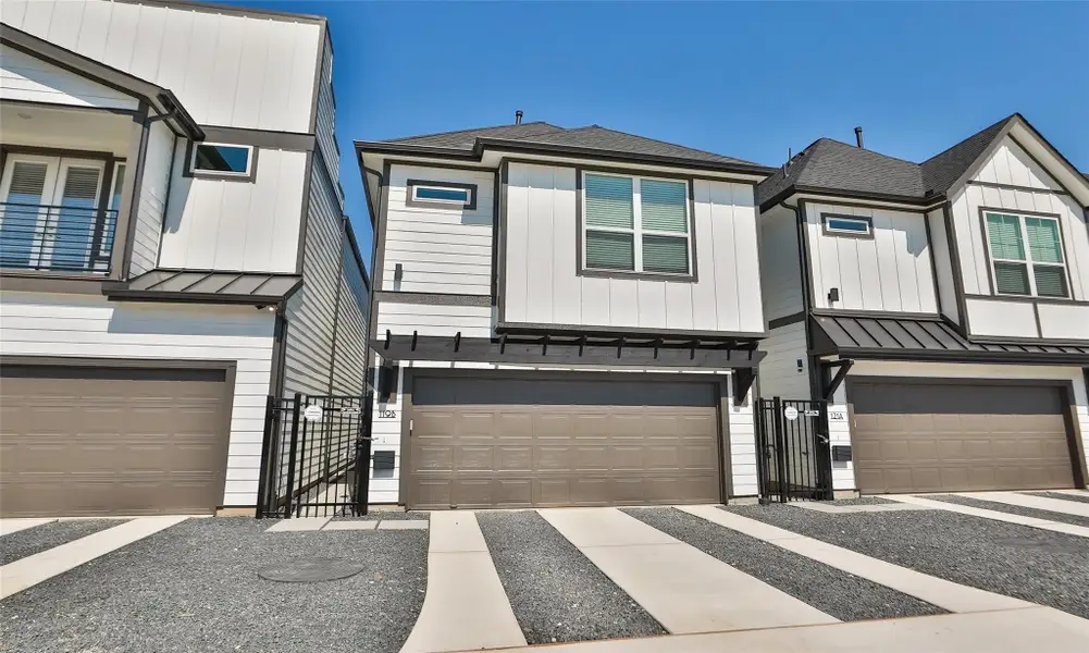 Front exterior of a new home in Independence Heights, Houston, TX, highlighting curb appeal (Image 2). Front exterior of a new home in Independence Heights, Houston, TX, highlighting curb appeal (Image 2).