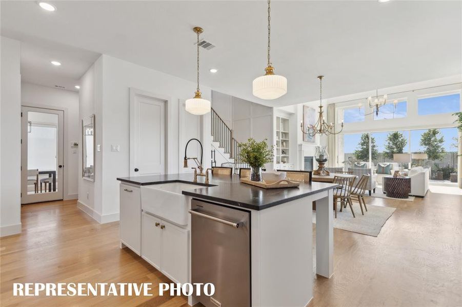 With a wonderfully designed open concept layout, the chef will never be left out of the party in this dream home!  REPRESENTATIVE PHOTO
