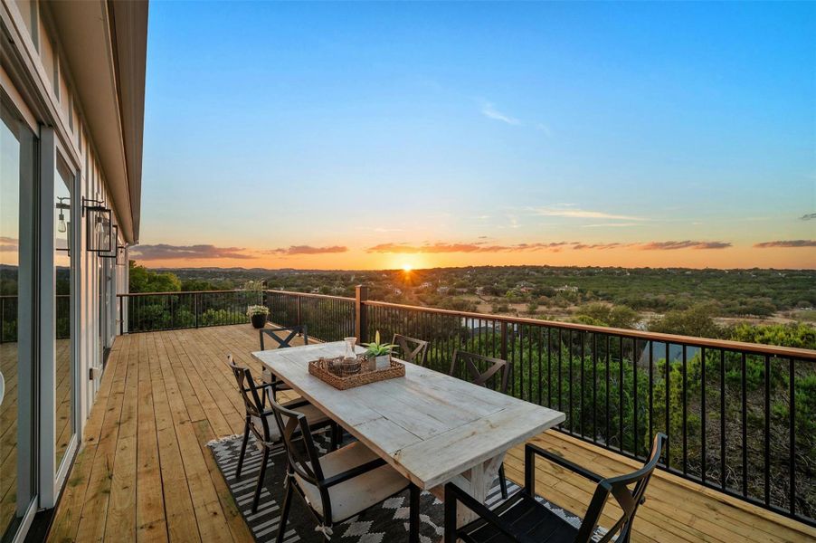 The large upper level balcony is perfect spot to take in breathtaking hill country sunset vistas.