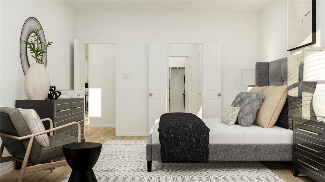 Bedroom with a closet, light hardwood / wood-style floors, and a walk in closet