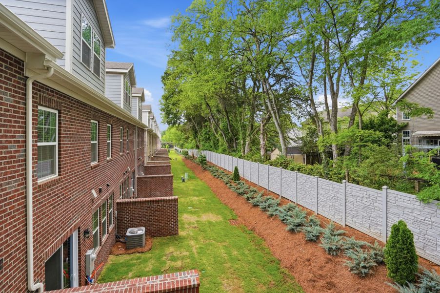Exterior details and patio area of a home in The Townes at Wade Ardrey, Charlotte (Image 24). Exterior details and patio area of a home in The Townes at Wade Ardrey, Charlotte (Image 24).