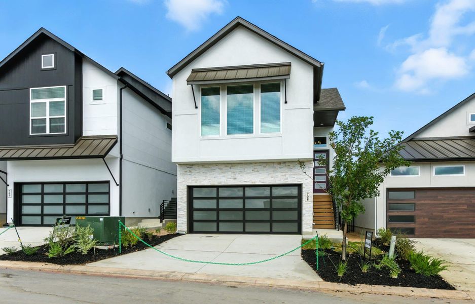 Representative exterior photo of a completed home built from the Calypso by Chesmar Homes in Centero at Stone Oak, San Antonio, TX (Image 19).
