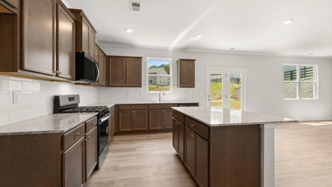 Furnished interior view inside a new home in Northwoods at Mirror Lake, Villa Rica (Image 7).