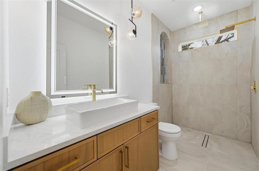 Primary bathroom featuring vanity and LED Mirror Primary bathroom featuring vanity and LED Mirror