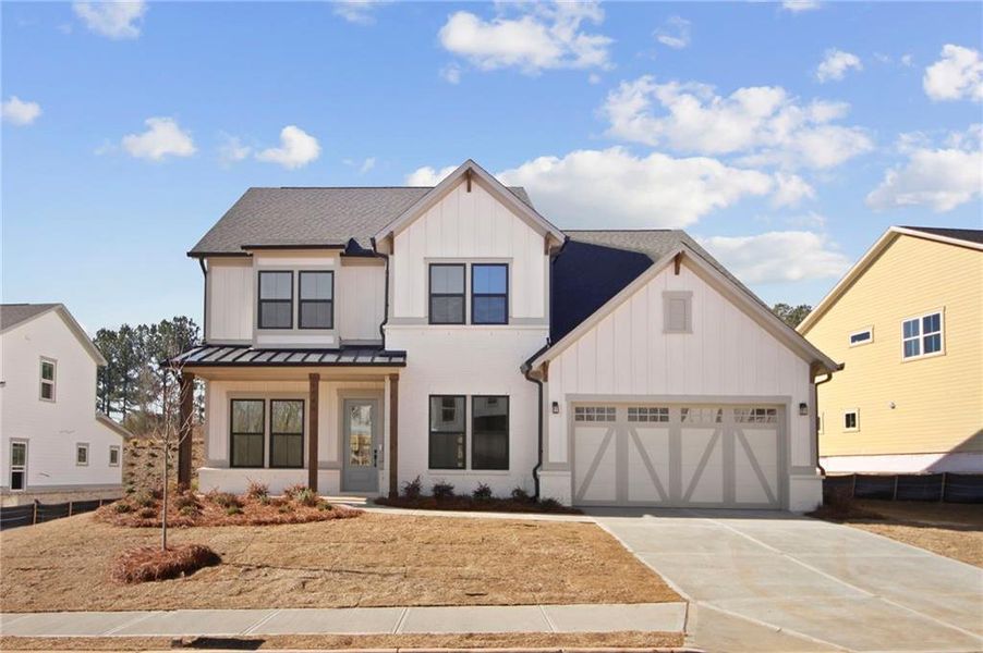 Front exterior of a new home in , Cumming, GA, highlighting curb appeal (Image 1). Front exterior of a new home in , Cumming, GA, highlighting curb appeal (Image 1).