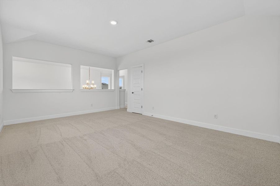 Unfurnished room with carpet floors, a chandelier, and recessed lighting