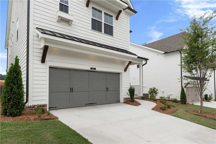 Front exterior of a new home in Palisades Single Family, Cumming, GA, highlighting curb appeal (Image 29).