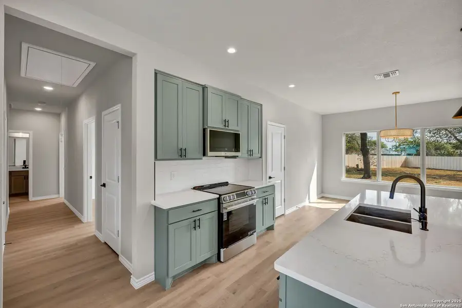 Furnished interior view inside a new home in , Elmendorf (Image 10).