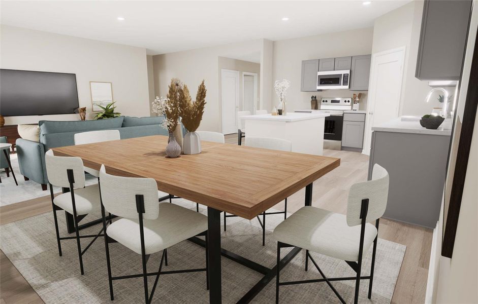Dining space featuring light wood-type flooring and recessed lighting