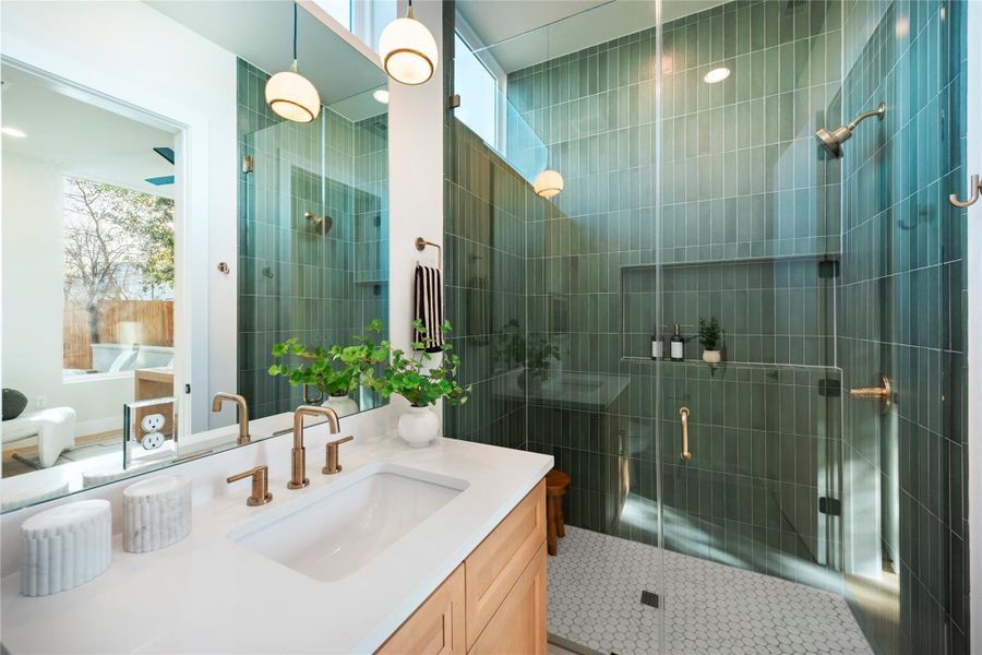 Full bathroom featuring a stall shower and vanity