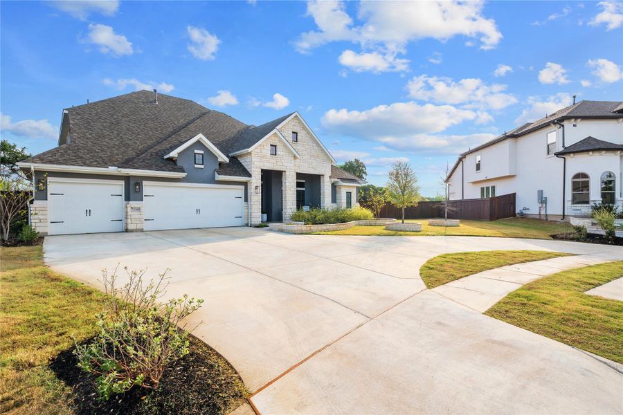 Front exterior of a new home in Bryson, Leander, TX, highlighting curb appeal (Image 2). Front exterior of a new home in Bryson, Leander, TX, highlighting curb appeal (Image 2).