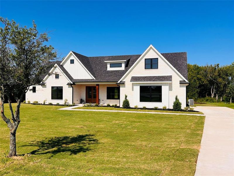 Long driveway and 4 foot sidewalk leading to the front door