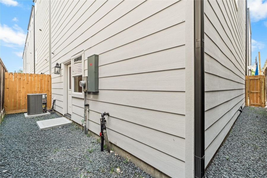 Gravel along the side and rear perimeter, which can be upgraded to turf and keeps exterior upkeep minimal while providing space for your fur babies to have their own space.
