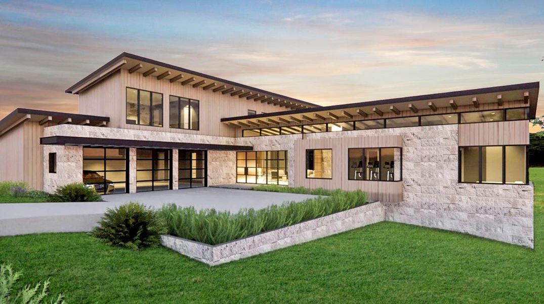 Rear view of property with stone siding and a yard