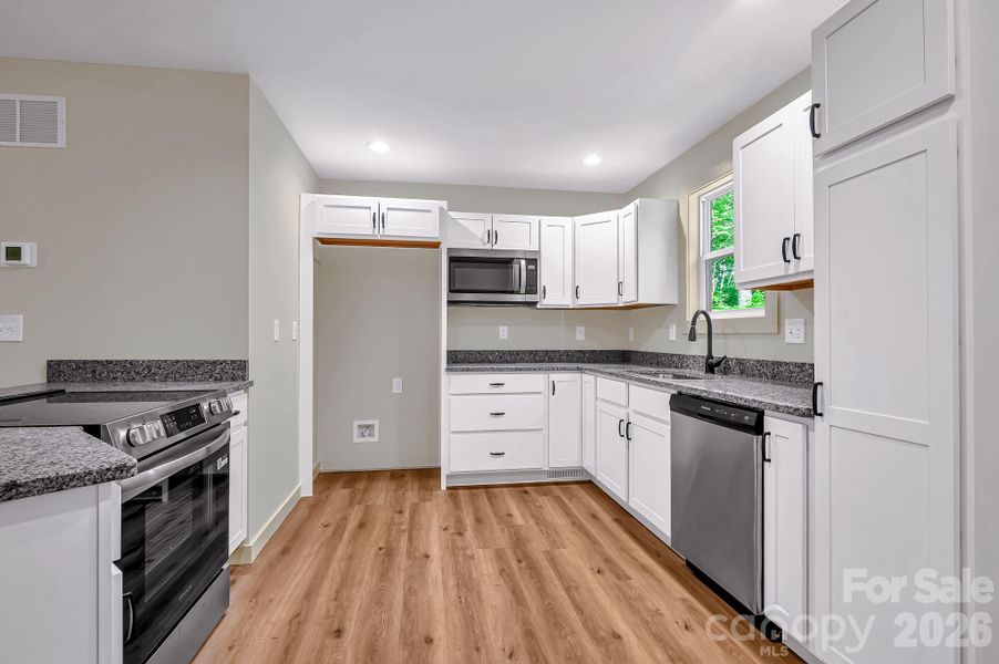 Furnished interior view inside a new home in , Waynesville (Image 5).