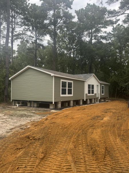 Front exterior of a new home in , Round O, SC, highlighting curb appeal (Image 11).