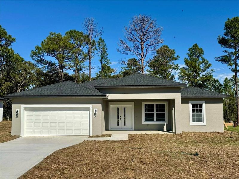 Front exterior of a new home in , Citrus Springs, FL, highlighting curb appeal (Image 10).