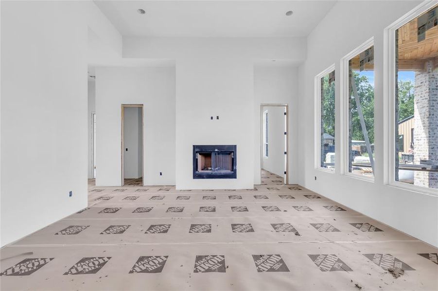 Unfurnished living room featuring a fireplace Unfurnished living room featuring a fireplace