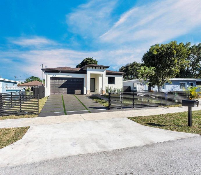 Front exterior of a new home in , North Miami, FL, highlighting curb appeal (Image 21).